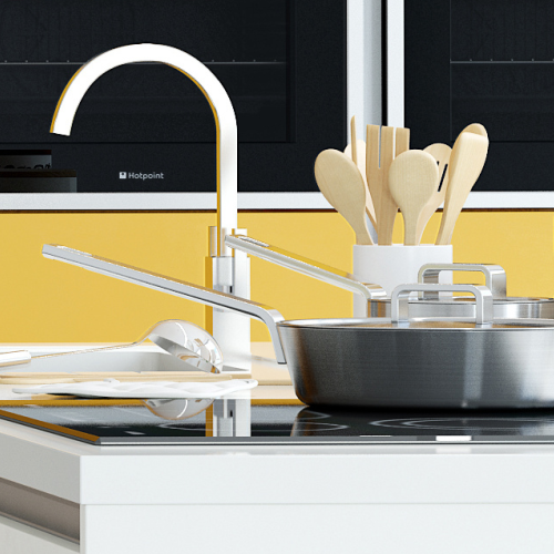 Image of hob in kitchen with pans and cooking utensils nearby